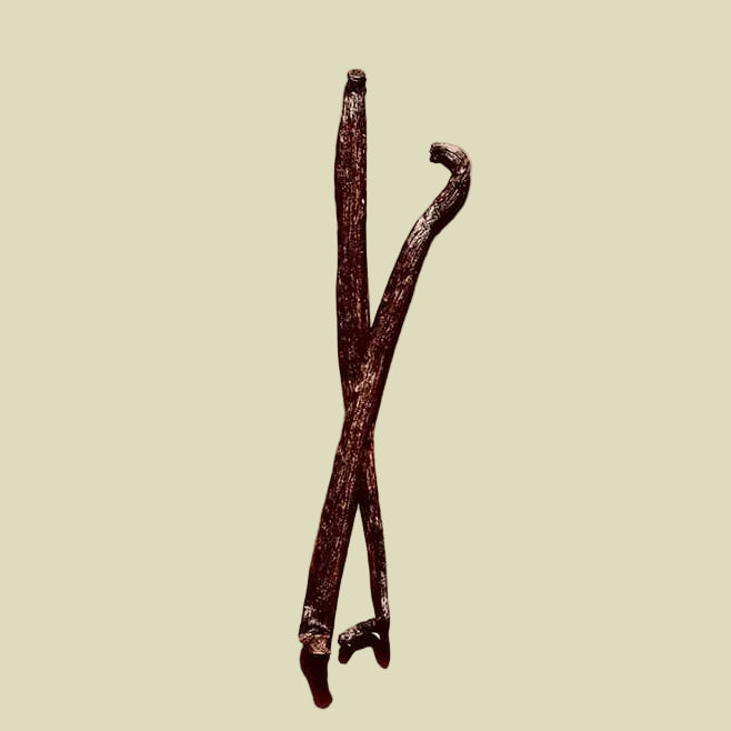 Vanilla beans on a beige background with text about Vanillyl Butyl Ether.